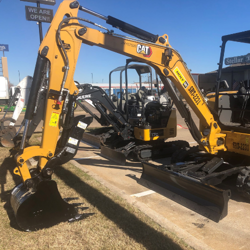A John Deere mini excavator in the Stellar Rentals Texas parking lot.