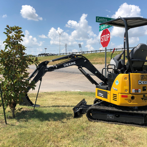 A John Deere skid steer in the Stellar Rentals Texas parking lot.