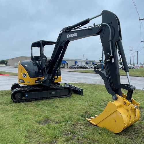 A John Deere excavator in the Stellar Rentals Texas parking lot.