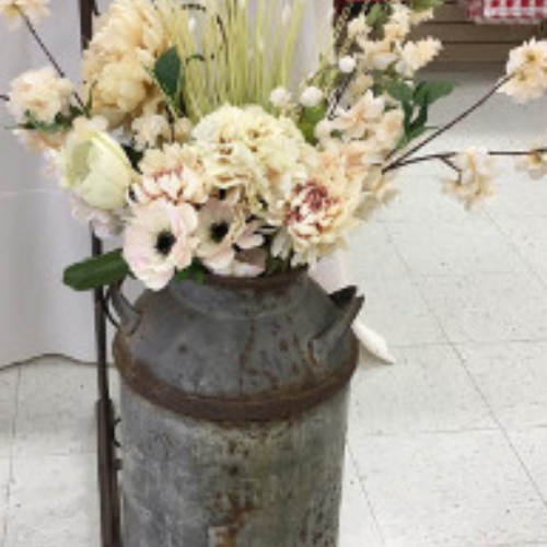 Wedding bouquet in a milk can