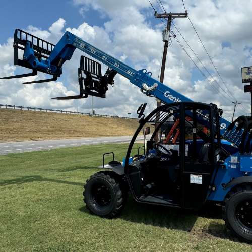A blue Genie boom lift in the Stellar Rentals Texas parking lot.