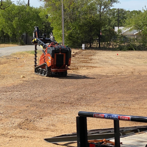An orange auger being used.