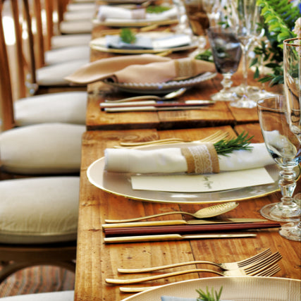 Party Event & WeddingsA banquet table full of plateware and linens